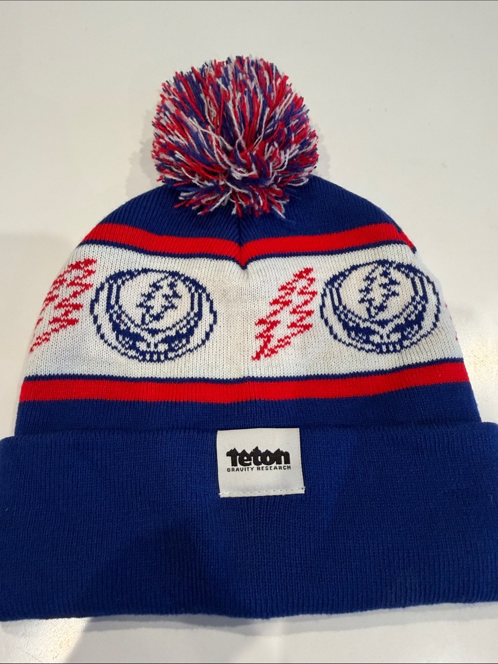 Teton Gravity Research Men’s Blue Red Pom Beanie Greatful Dead Collab